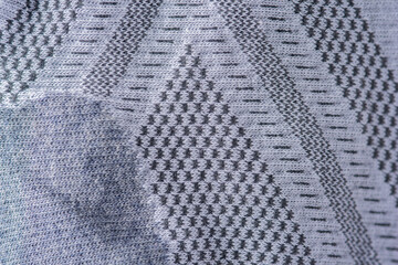 Close-up of cotton fabric with a gray-white pattern.