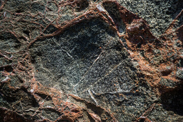 Colorful rock texture. Natural cracks void.