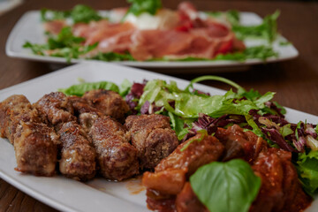 Grilled meat with vegetables on the plate in restaurant