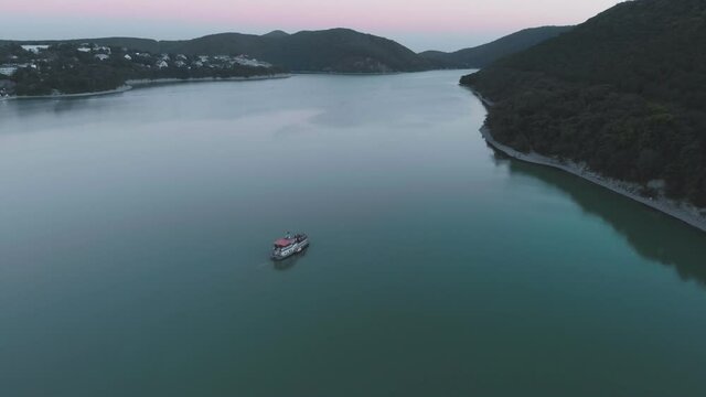 flight over the lake and over the ferry to the abrau durso under the anapa winery sunset day