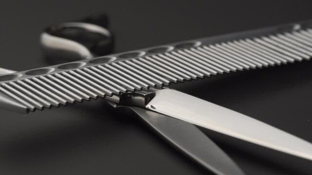 hairdresser comb and scissors macro slow motion