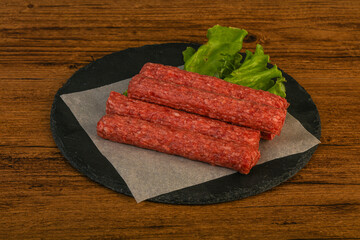 Raw beef sausages with spices