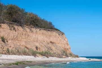 Fototapeta na wymiar Effects of seaside coastal erosion with clayey soil