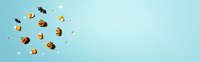 Miniature Halloween pumpkin ghosts with decorations - flat lay