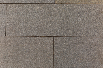 Surface of gray paving slabs. Background. Space for text.