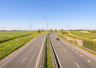 Rural road with two times two lanes in the Netherlands.