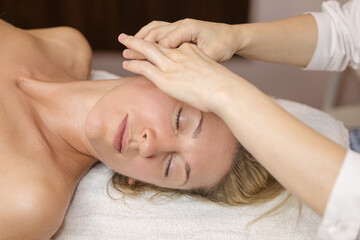 Face Massage. Close-up of a Young Woman Getting Spa beauty Treatment. Facial ana beautican professional