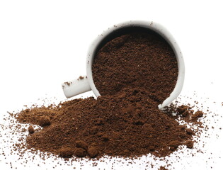 Pile of powdered, instant coffee and porcelain cup isolated on white background