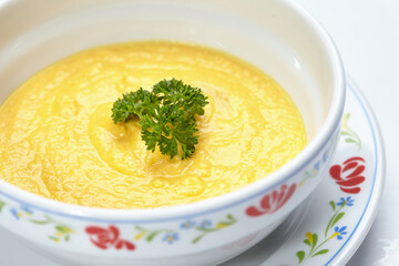 pumpkin cream soup isolated on white