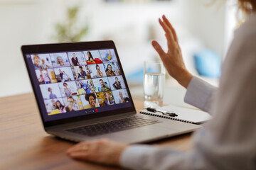 Friends video conferencing on laptop screen