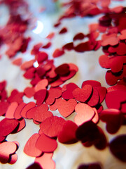 hearts confetti on the golden background
