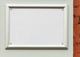 An empty metal frame mounted on the wall