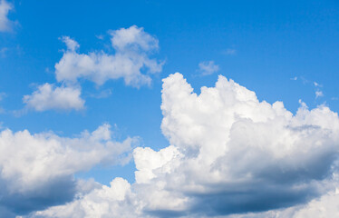 Naklejka na ściany i meble Blue sky with white cumulus clouds at daytime