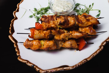 grilled chicken wings on a skewer