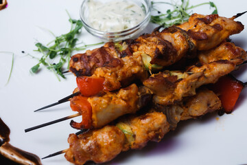 grilled chicken wings on a skewer
