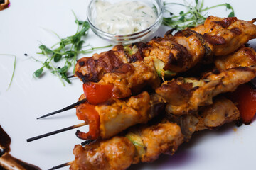 grilled chicken wings on a skewer