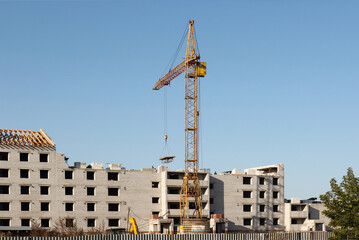 New complex of apartment buildings under construction with crane