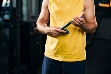 Boxer holding blue band in his hands