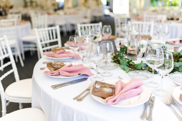 Luxury wedding table decoration in pink and white. Special event table set up. Fresh flower decoration.