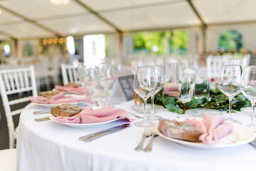 Luxury wedding table decoration in pink and white. Special event table set up. Fresh flower decoration.