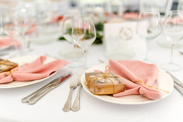 Luxury table set up for a special event - pink napkins and  candles decoration.