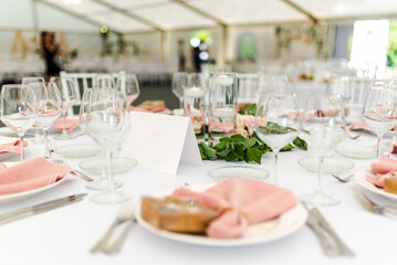 Luxury wedding table decoration in pink and white. Special event table set up. Fresh flower decoration.