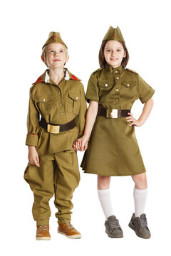 Happy boy and girl wearing russian vintage military uniform.are holding hands isolated at white background. Concept of children friendship.