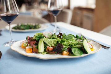 Fresh vegetables salad on served restaurant table
