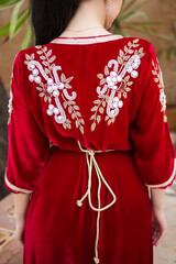 Moroccan traditional dress, embroidery on the caftan. Festive women's clothing in Morocco