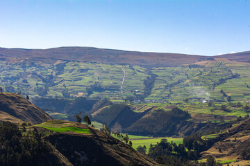 Fototapeta na wymiar Green fields of Ecuador, beautiful valleys of the Andes Mountains