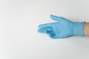 COVID, COVID-19 PPE Blue Latex Glove on Lady's Hand, On White Background
