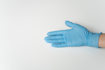 COVID, COVID-19 PPE Blue Latex Glove on Lady's Hand, On White Background
