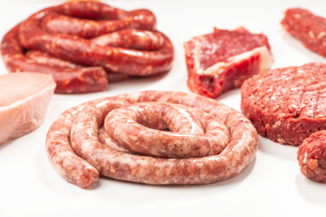 Beef sausages, meatballs, patty, kebab and steak on white backgr