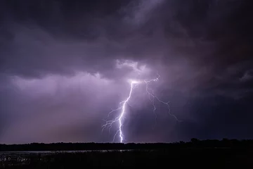Fotobehang Lightning produced by storms moving across the Wisconsin landscape  © Jonah