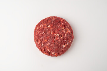 Top view on a beef patty on white background
