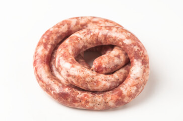 Top view on a rolled beef sausage on white background