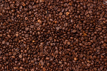 Background from coffee beans. Roasted coffee beans. Brown coffee beans in whole background.