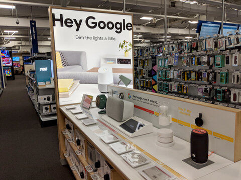 'Hey Google' Google Home Hub Logo on Display featuring google products inside of Best Buy Store