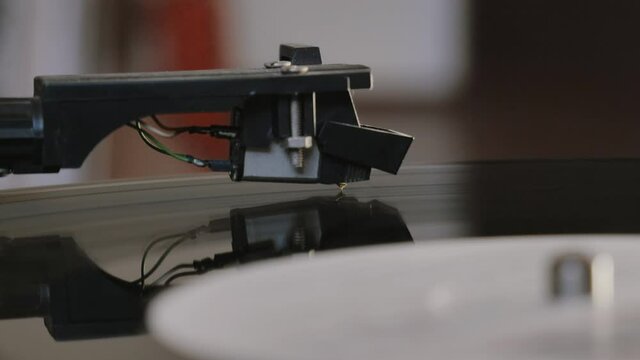 Vinyl record is spinning. Old retro turntable.Turntable stylus on a record