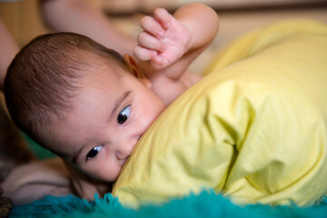 baby lies on a pillow. close-up