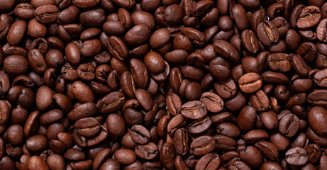 Background from coffee beans. Roasted coffee beans. Brown coffee beans in whole background.
