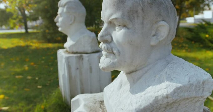 Bust of Lenin and Stalin in the Sculpture Park at summer in Moscow, Russia