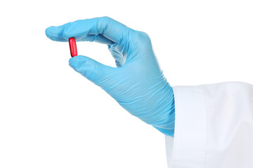 Doctor hand in glove holding pill on white background