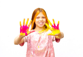 selective focus happy girl painted with Holi festival on white wall background