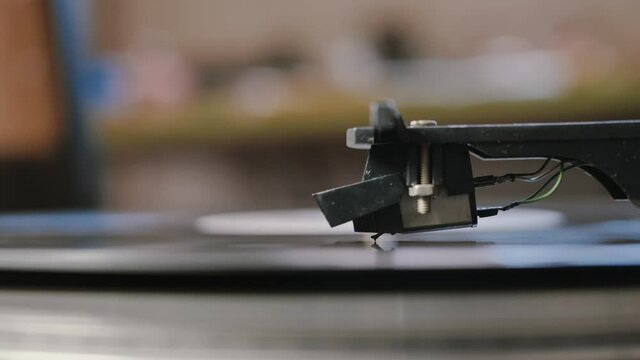 Vinyl record is spinning. Old retro turntable.Turntable stylus on a record