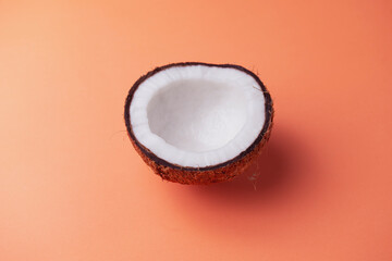 coconut with orange background, with dim light