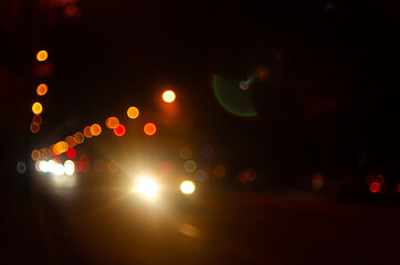 Night city blurred lights of cars on the road 1