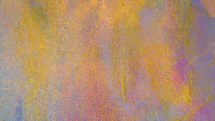 Golden grunge background of shiny paint stains.