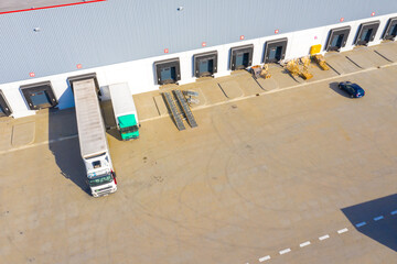 Naklejka premium Aerial view of the distribution center, drone photography of the industrial logistic zone.