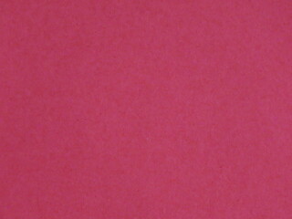 Beautiful background from crimson paper close-up.